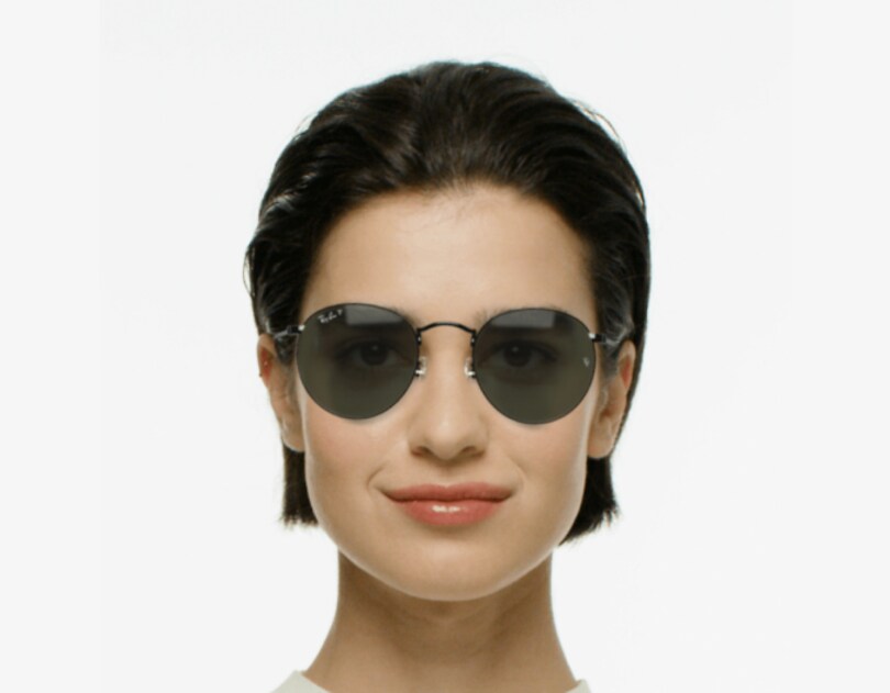standard sunglasses coverage shown on the same face for comparison.
